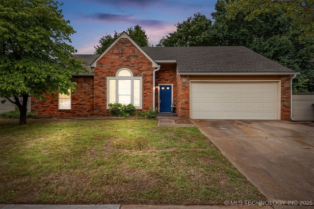 4908 S Redbud Ave, Broken Arrow, OK 74011 - view of front facade with driveway, a garage, brick siding, and a lawn