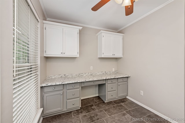 4908 S Redbud Ave, Broken Arrow, OK 74011 - unfurnished office with built in desk, a ceiling fan, ornamental molding, baseboards, and dark tile patterned floors