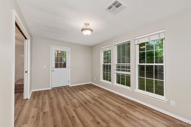 4908 S Redbud Ave, Broken Arrow, OK 74011 - spare room with light wood-type flooring and baseboards