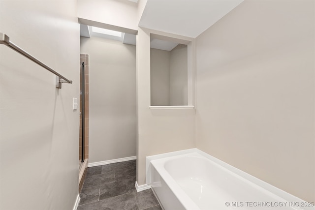 4908 S Redbud Ave, Broken Arrow, OK 74011 - bathroom featuring a bath, a shower with door, and baseboards