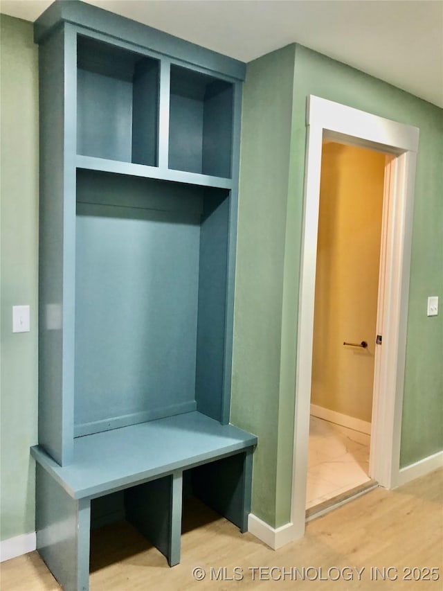 1423 E Walnut St, Cushing, OK 74023 - mudroom with baseboards and wood finished floors