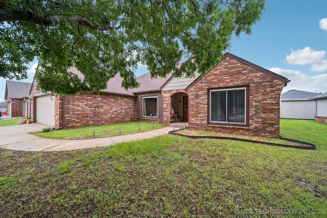109 W 133rd Pl, Skiatook, OK 74070 - view of front facade with brick siding, a front yard, and an attached garage