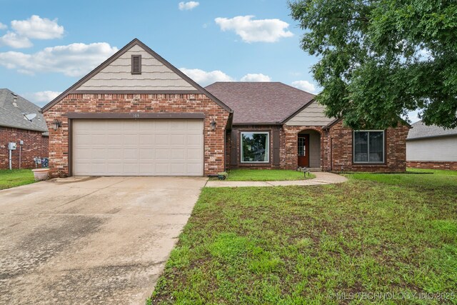 109 W 133rd Pl, Skiatook, OK 74070 - view of front facade featuring brick siding, concrete driveway, a front lawn, a garage, and a shingled roof