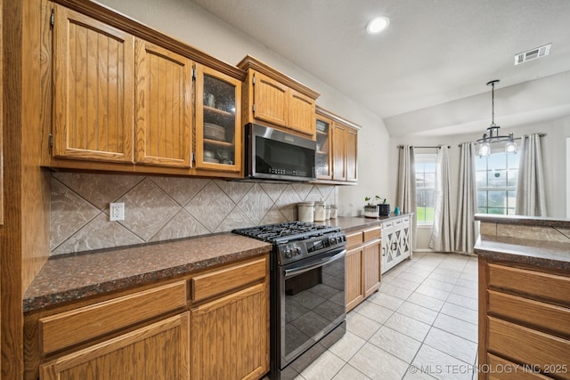 109 W 133rd Pl, Skiatook, OK 74070 - kitchen featuring black range with gas cooktop, lofted ceiling, backsplash, glass insert cabinets, and light tile patterned floors