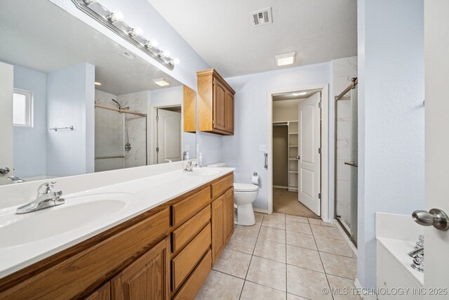 109 W 133rd Pl, Skiatook, OK 74070 - full bath featuring a stall shower, double vanity, toilet, and a spacious closet