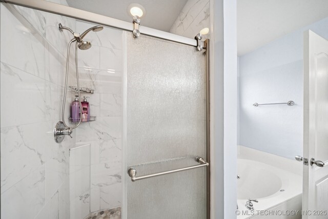 109 W 133rd Pl, Skiatook, OK 74070 - bathroom with a marble finish shower and a garden tub