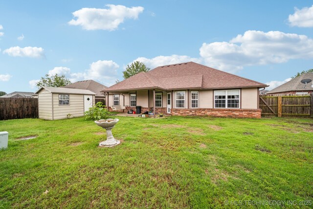 109 W 133rd Pl, Skiatook, OK 74070 - back of house with a shingled roof and brick siding