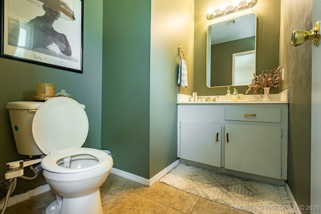 514 N Village Pl, Broken Arrow, OK 74012 - half bathroom featuring baseboards, toilet, vanity, and tile patterned floors