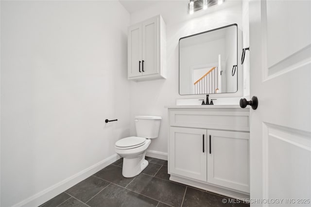 2410 W Charleston St, Broken Arrow, OK 74011 - bathroom with baseboards, vanity, toilet, and tile patterned floors