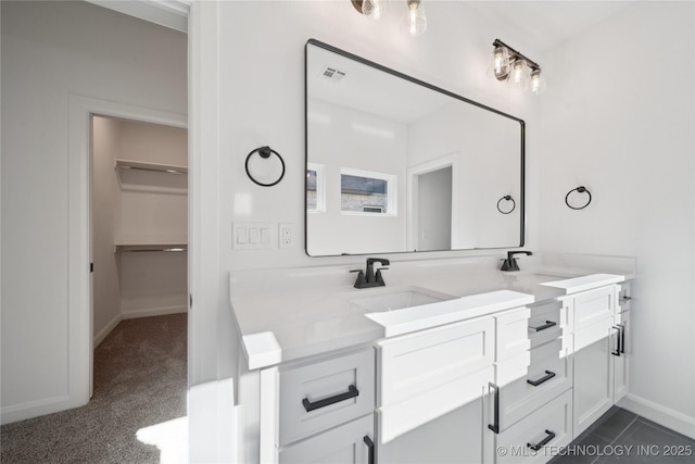 2410 W Charleston St, Broken Arrow, OK 74011 - full bathroom with double vanity, baseboards, and a spacious closet