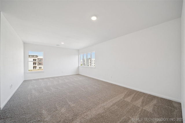 2410 W Charleston St, Broken Arrow, OK 74011 - spare room featuring carpet floors, baseboards, and recessed lighting