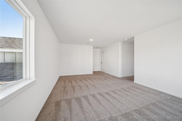2410 W Charleston St, Broken Arrow, OK 74011 - spare room with carpet flooring, baseboards, healthy amount of natural light, and recessed lighting