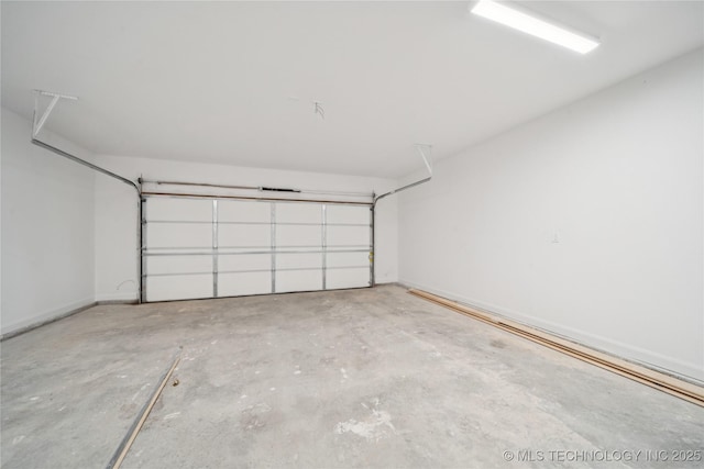 2410 W Charleston St, Broken Arrow, OK 74011 - garage featuring baseboards