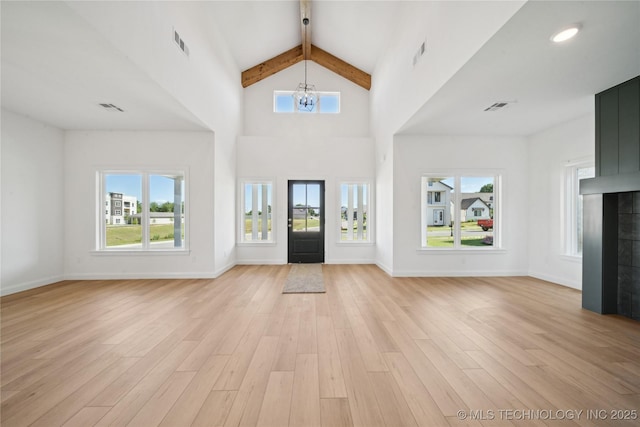 2410 W Charleston St, Broken Arrow, OK 74011 - foyer entrance featuring a chandelier, beamed ceiling, healthy amount of natural light, light wood-type flooring, and high vaulted ceiling