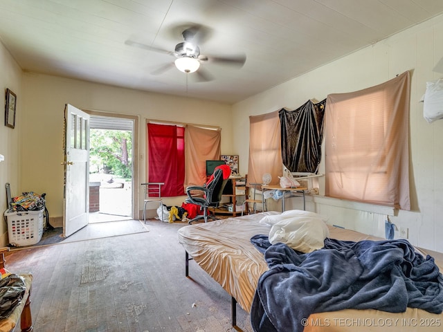 309 W 14th, Ada, OK 74820 - bedroom with access to exterior, hardwood / wood-style flooring, and ceiling fan