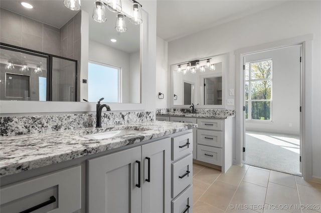 2332 E 135th Dr S, Bixby, OK 74008 - bathroom featuring vanity, a shower stall, tile patterned flooring, and recessed lighting