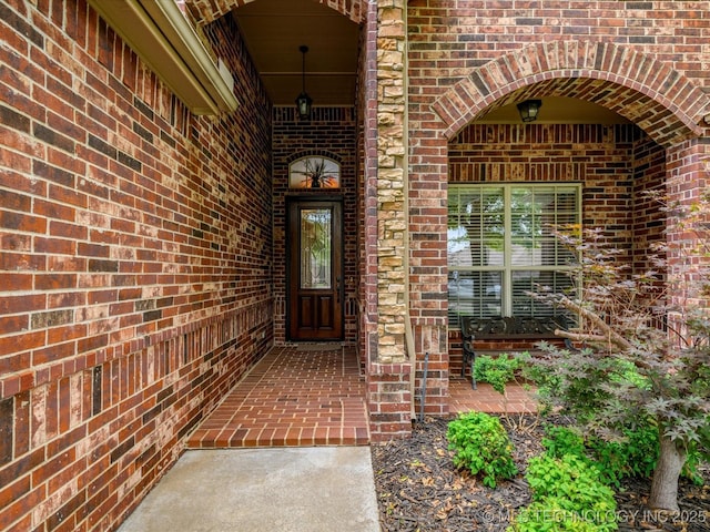 5816 Woodland Rd, Bartlesville, OK 74006 - view of exterior entry featuring brick siding