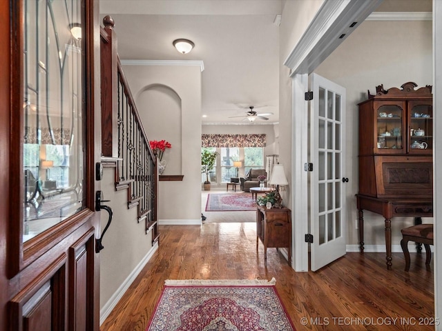5816 Woodland Rd, Bartlesville, OK 74006 - foyer with wood finished floors, stairs, ornamental molding, and a ceiling fan