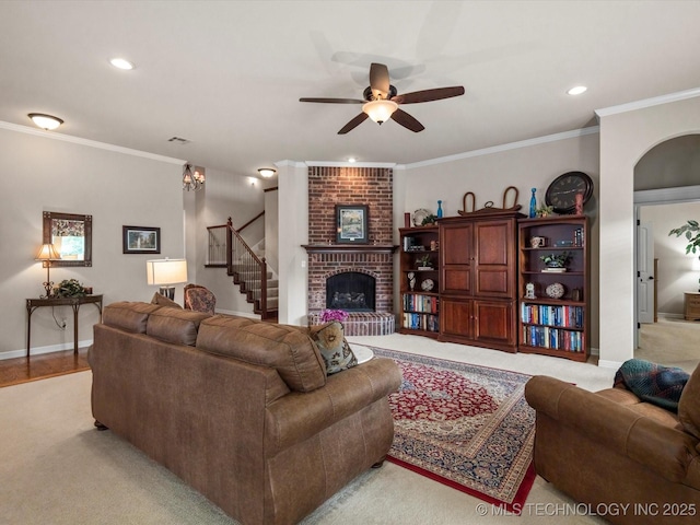 5816 Woodland Rd, Bartlesville, OK 74006 - living area featuring a ceiling fan, a fireplace, ornamental molding, stairway, and recessed lighting