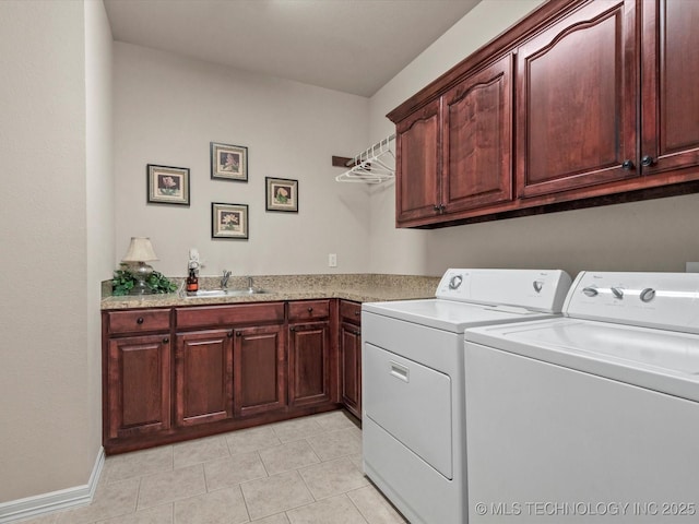 5816 Woodland Rd, Bartlesville, OK 74006 - laundry area with washing machine and clothes dryer, cabinet space, and light tile patterned floors