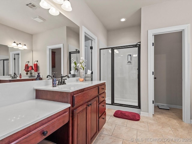 5816 Woodland Rd, Bartlesville, OK 74006 - bathroom with a stall shower, vanity, tile patterned floors, and recessed lighting