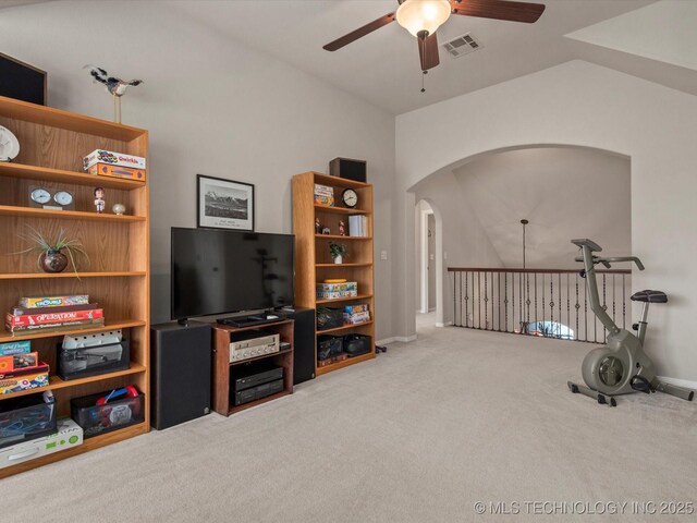 5816 Woodland Rd, Bartlesville, OK 74006 - workout room with ceiling fan, arched walkways, and carpet flooring