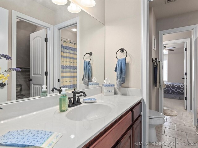 5816 Woodland Rd, Bartlesville, OK 74006 - ensuite bathroom with vanity and a ceiling fan