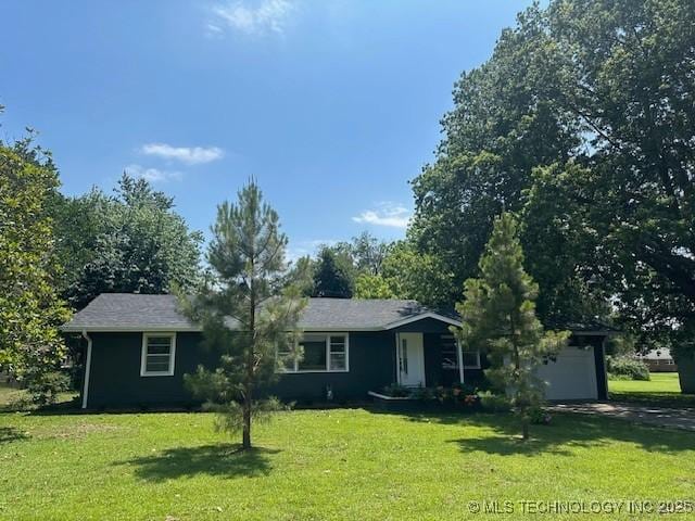 111 E 13th Pl, Claremore, OK 74017 - view of front facade featuring a front yard, an attached garage, and driveway