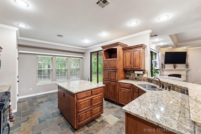 18932 Spring Creek Ln, Claremore, OK 74017 - kitchen with a sink, baseboards, black gas stove, light stone countertops, and ornamental molding