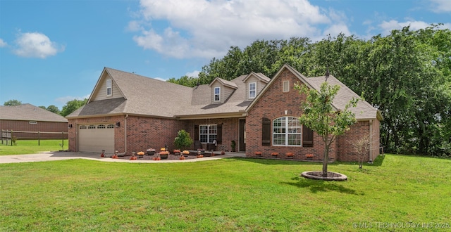 18932 Spring Creek Ln, Claremore, OK 74017 - view of front of house featuring brick siding, driveway, an attached garage, and roof with shingles