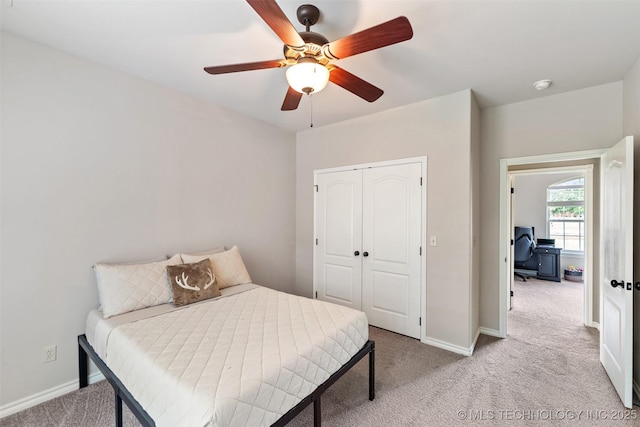 18932 Spring Creek Ln, Claremore, OK 74017 - bedroom with light colored carpet, a closet, baseboards, an office area, and a ceiling fan