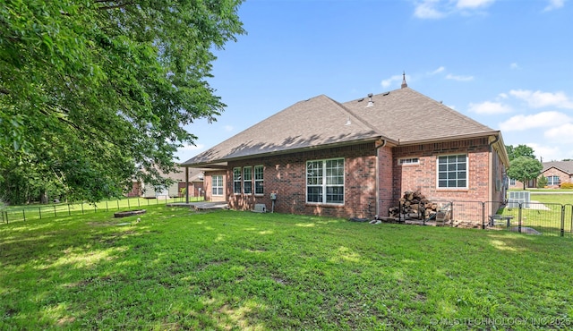 18932 Spring Creek Ln, Claremore, OK 74017 - rear view of property featuring brick siding and roof with shingles