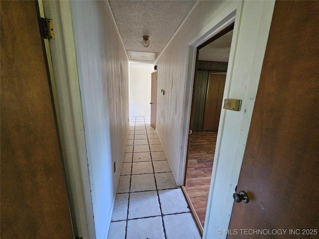 2700 N Witte St, Poteau, OK 74953 - hallway with tile patterned floors and a textured ceiling
