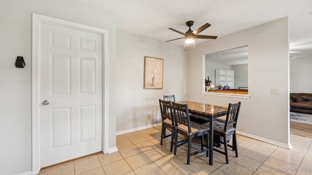 4964 SE Brookline Dr, Bartlesville, OK 74006 - dining space with light tile patterned flooring and a ceiling fan