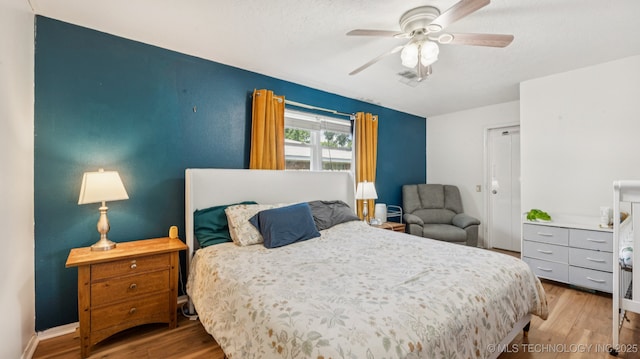 4964 SE Brookline Dr, Bartlesville, OK 74006 - bedroom featuring wood finished floors and a ceiling fan