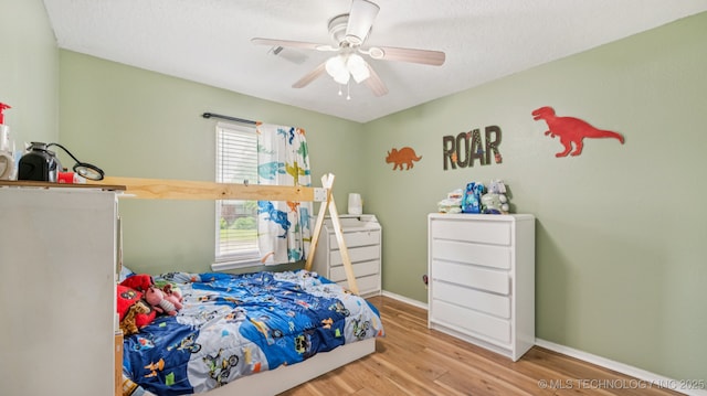 4964 SE Brookline Dr, Bartlesville, OK 74006 - bedroom with wood finished floors and ceiling fan