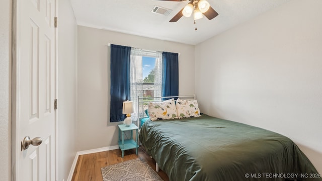 4964 SE Brookline Dr, Bartlesville, OK 74006 - bedroom with wood finished floors and ceiling fan