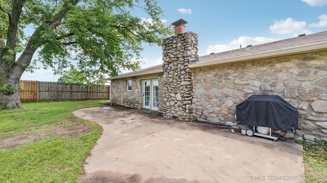4964 SE Brookline Dr, Bartlesville, OK 74006 - view of patio / terrace featuring grilling area and french doors