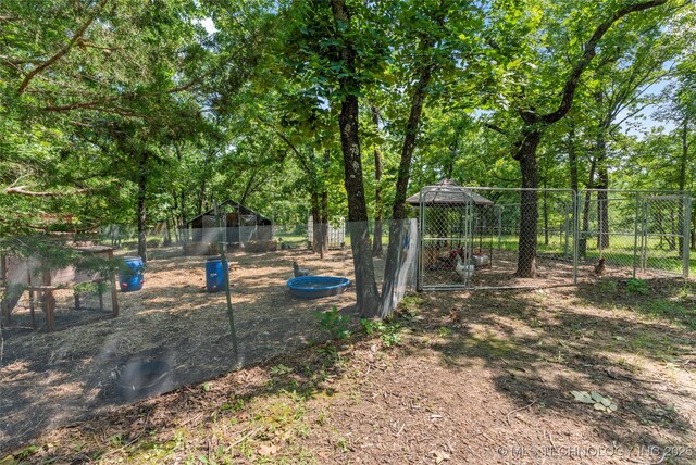 8562 Adams Creek Rd, Beggs, OK 74421 - view of yard with an outbuilding