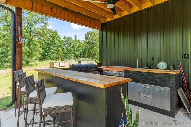 8562 Adams Creek Rd, Beggs, OK 74421 - view of patio / terrace featuring a ceiling fan