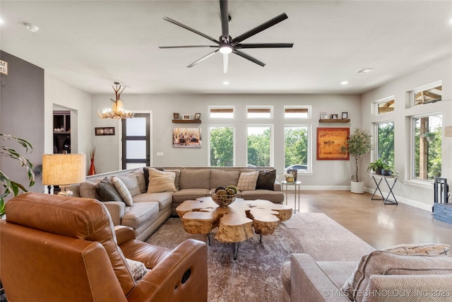 8562 Adams Creek Rd, Beggs, OK 74421 - living room with plenty of natural light, baseboards, recessed lighting, a chandelier, and a ceiling fan