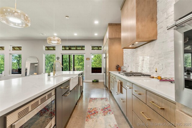 8562 Adams Creek Rd, Beggs, OK 74421 - kitchen with backsplash, healthy amount of natural light, appliances with stainless steel finishes, light countertops, and recessed lighting
