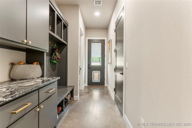 8562 Adams Creek Rd, Beggs, OK 74421 - mudroom featuring baseboards and concrete flooring