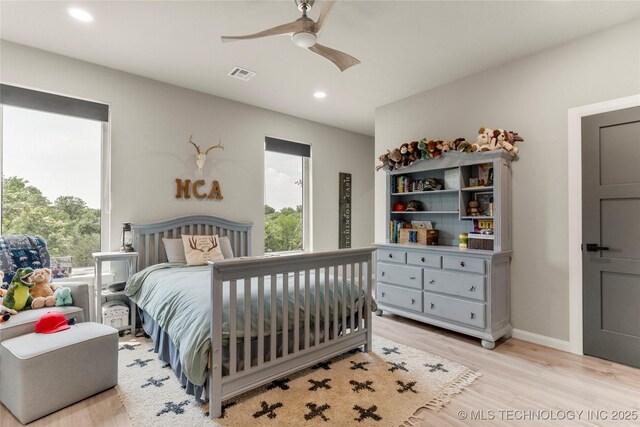 8562 Adams Creek Rd, Beggs, OK 74421 - bedroom with multiple windows, light wood-style flooring, recessed lighting, baseboards, and a ceiling fan