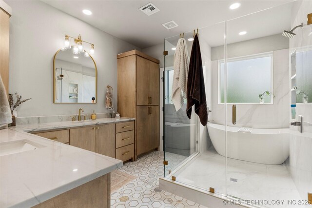 8562 Adams Creek Rd, Beggs, OK 74421 - bathroom with vanity, a freestanding bath, a stall shower, and recessed lighting