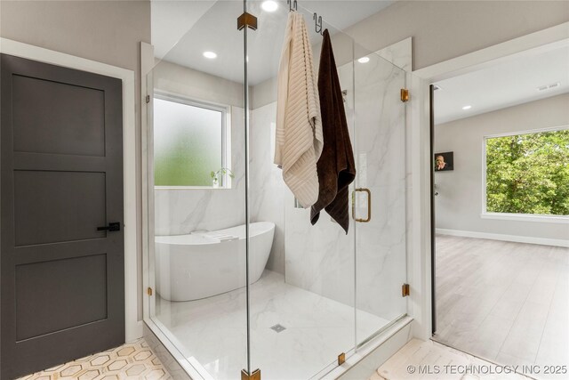 8562 Adams Creek Rd, Beggs, OK 74421 - bathroom with a marble finish shower, recessed lighting, and a soaking tub