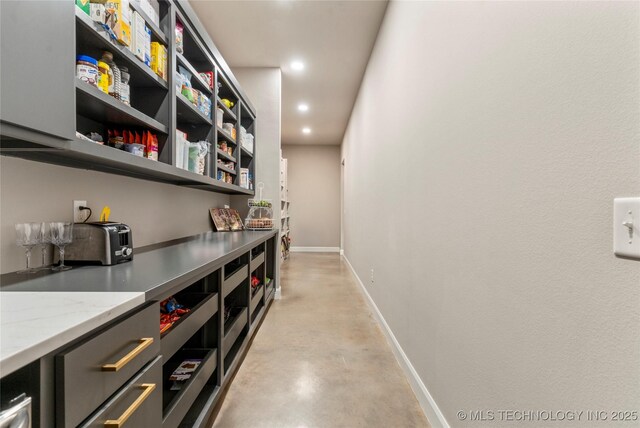 8562 Adams Creek Rd, Beggs, OK 74421 - bar with baseboards, concrete flooring, and recessed lighting