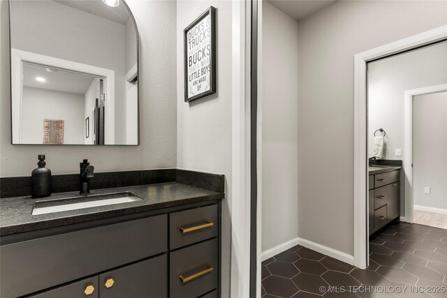 8562 Adams Creek Rd, Beggs, OK 74421 - bathroom featuring vanity, tile patterned floors, and baseboards