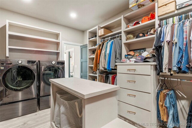 8562 Adams Creek Rd, Beggs, OK 74421 - spacious closet with separate washer and dryer and light wood finished floors