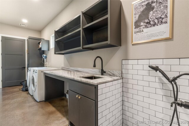 8562 Adams Creek Rd, Beggs, OK 74421 - washroom featuring cabinet space and washer and clothes dryer
